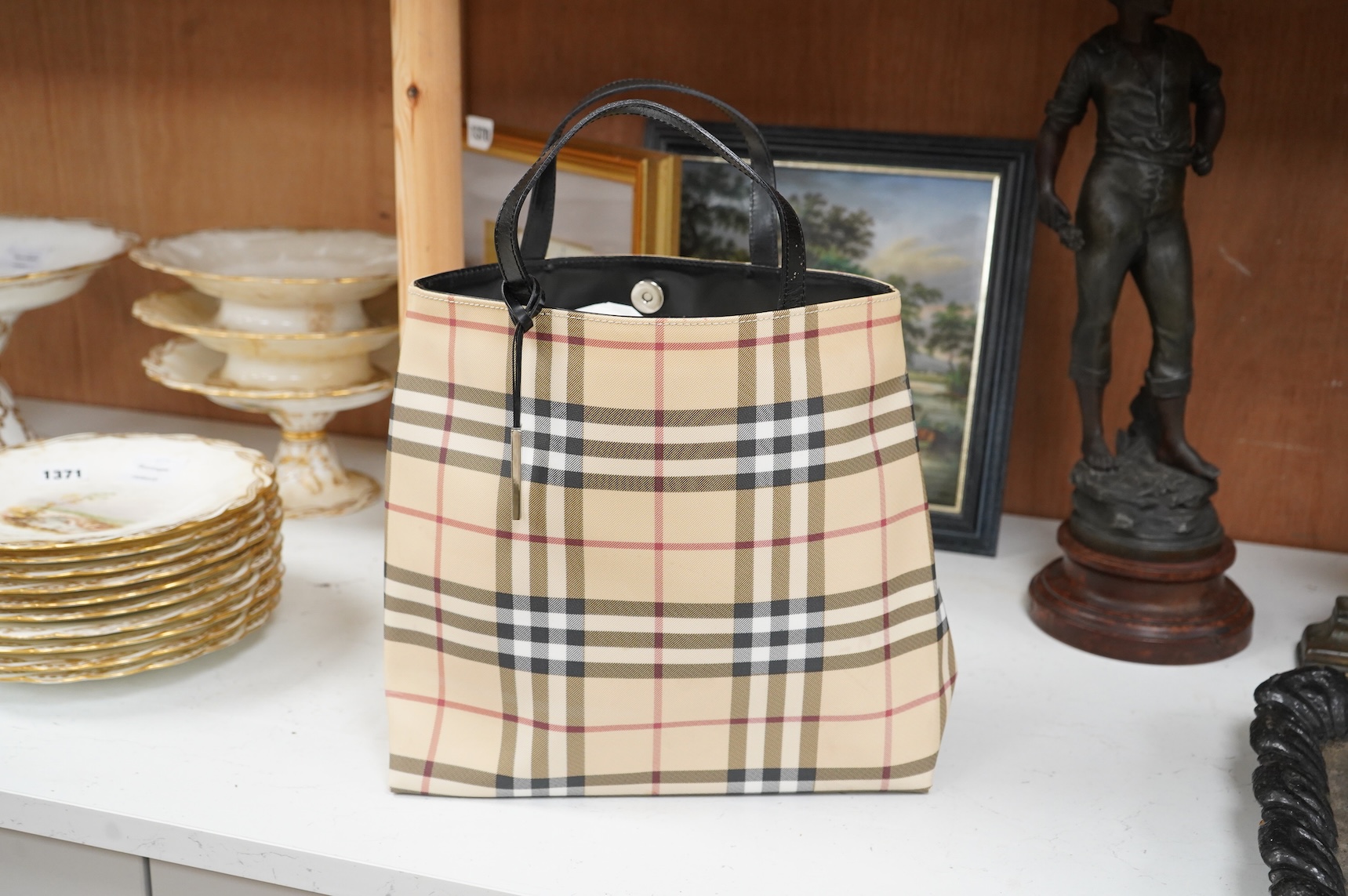 A Burberry handbag with PCV check exterior, 28cm wide
